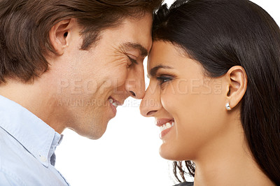 Buy stock photo Couple, forehead and smile for love, valentines day or date in affection isolated against white studio background. Closeup of man and woman smiling touching heads embracing special month of romance
