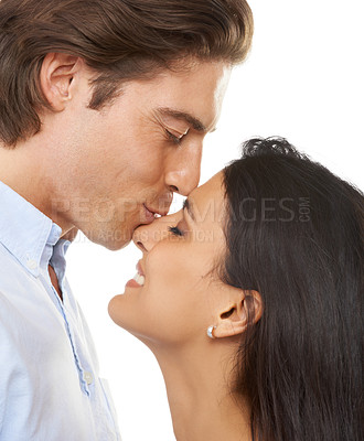 Buy stock photo Couple, kiss and nose for valentines day, love or embracing relationship isolated against a white studio background. Closeup of happy man kissing woman face for intimate romance, bonding or embrace