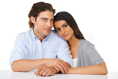 Buy stock photo Portrait, love and couple together in a studio with white background and hand holding. Sitting, studio and smile of a young man and woman from Israel in marriage with casual fashion and connection