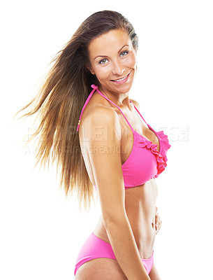 Buy stock photo Studio shot of a gorgeous woman posing in a pink bikini against a white background