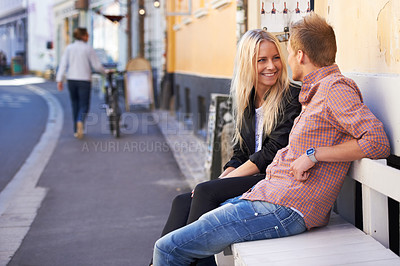 Buy stock photo Couple, love or happy on bench in city, weekend relax or communication in healthy relationship. English man, woman or smile for conversation in marriage, care or romance together outdoor in cambridge