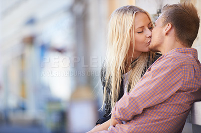Buy stock photo Couple, love or kiss in city with romance, relax or weekend date for bond in quality time together. Happy man, woman or intimate connection in relationship, marriage or care on honeymoon in england