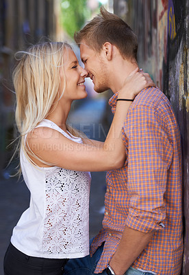 Buy stock photo Love, city and couple hug on road for date, cute relationship and bonding outdoors on weekend. Dating, romance and happy man and woman embrace for flirting, connection and adventure in urban town