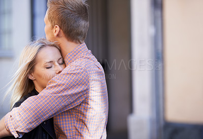 Buy stock photo Love, city and couple hug in street for date, cute relationship and bonding outdoors on weekend. Dating, romance and happy man and woman embrace for flirting, connection and affection in urban town