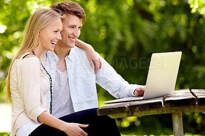 Buy stock photo Park, laptop and relax couple happy for online movie, social network or funny video in nature, garden or romantic date. Happiness, wellness and spring man, woman or marriage people streaming media
