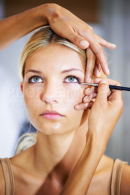 Buy stock photo Makeup, stylist and brush on face of woman for cosmetics, beauty or application of eyeshadow color. Eyes, powder and hands on model with cosmetic, mascara and skincare for celebrity or actor in salon