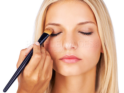 Buy stock photo Eyeshadow, makeup brush and woman in studio with hands for beauty, wellness or glamour makeover on white background. Powder, cosmetics lady model face with beautician for professional eye application
