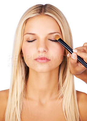 Buy stock photo Makeup brush, eyeshadow woman in studio with hands for beauty, wellness or glamour makeover on white background. Powder, cosmetics lady model face with beautician for professional eye application
