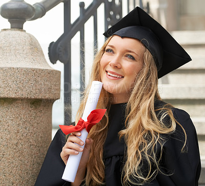 Buy stock photo Inspired young graduate after graduation holding a diploma