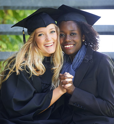 Buy stock photo Portrait, graduation and women university friends holding hands on campus together as graduate students. Happy, smile and education with a female college student and her friend celebrating graduating