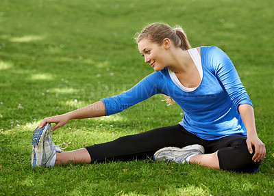 Buy stock photo Woman, hands and stretching foot on grass, park or outdoor at start of exercise or workout. Female, athlete or person in warm up with legs or feet with fitness, preparation or healthy routine