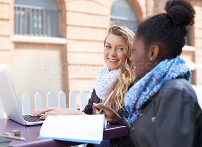 Buy stock photo Women, outdoor and students with a laptop, notebook and discussion for research, project and share ideas. Young people, cafe and happy friends brainstorming, university and development with knowledge