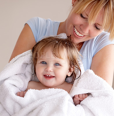Buy stock photo Cropped shot of a mother carrying her newly washed baby in a towel
