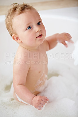Buy stock photo Baby, bubbles and bath or water cleaning for skin or hair wash for childhood development, hygiene or soap. Child, boy and tub for relax wellness or wet in home for play or cleansing, foam or sanitary