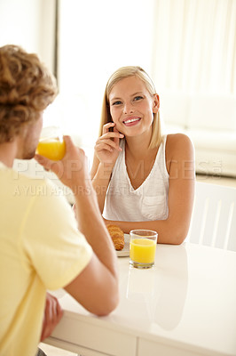 Buy stock photo Portrait of a couple sitting together and enjoying breakfast