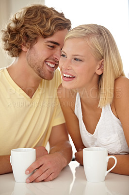 Buy stock photo Portrait of a couple sitting together and enjoying a cup of coffee
