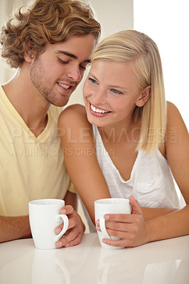 Buy stock photo Couple, coffee and table smile in morning for breakfast drink, marriage whisper, together or conversation. Man, woman and cup for love latte for weekend connection, relax bonding or peace in kitchen