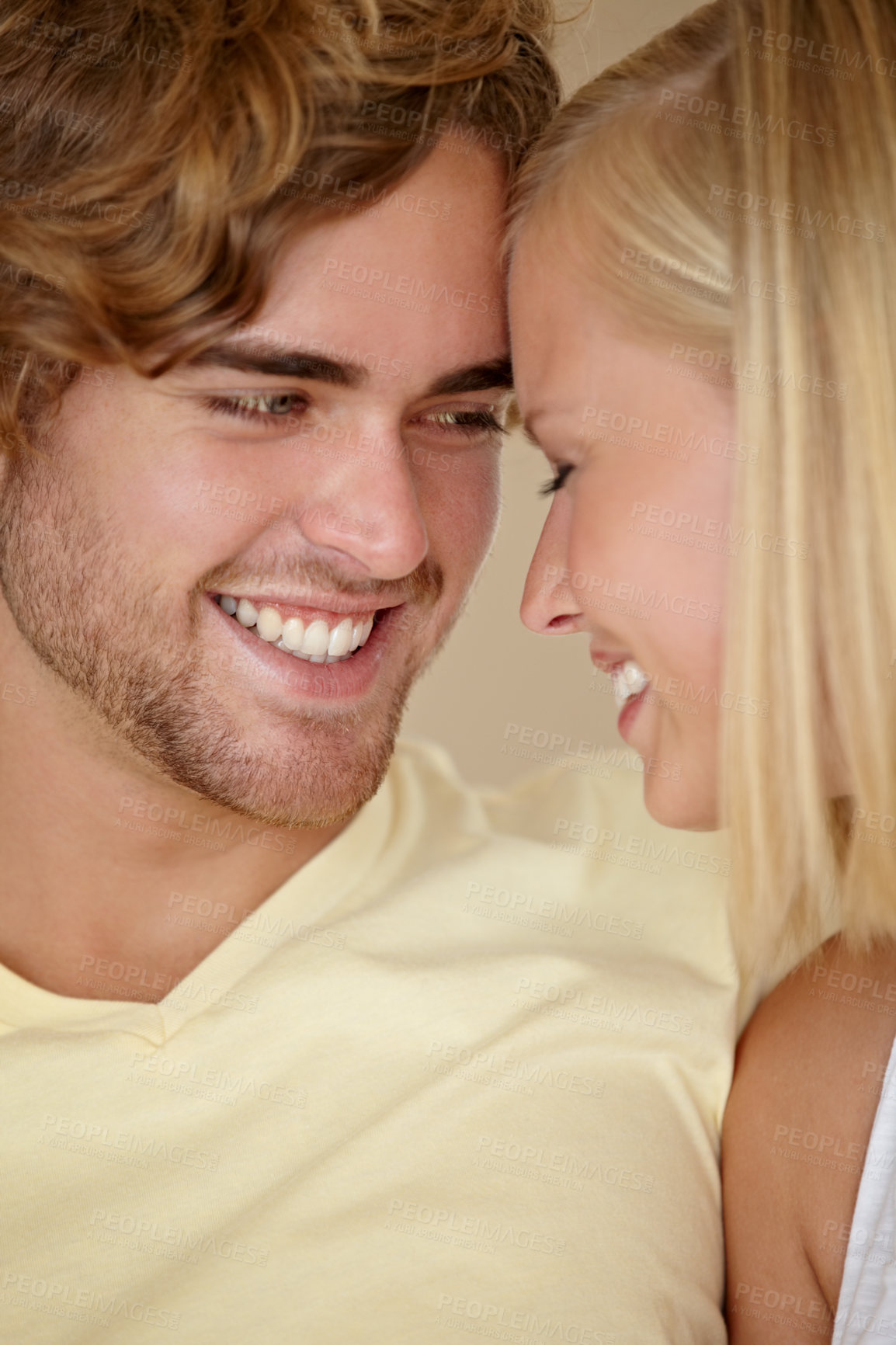 Buy stock photo Face, love and relax with a young couple closeup in their home together for romance or bonding. Smile, happy or dating with a man and woman in their apartment to relax during a weekend break