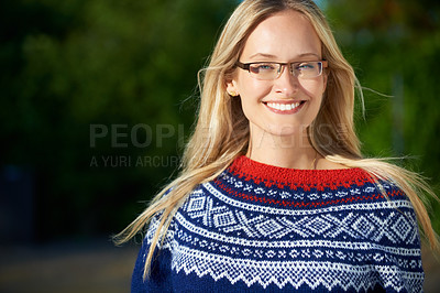 Buy stock photo Shot of an attractive young woman enjoying a day outside