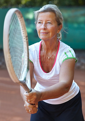 Buy stock photo Woman, tennis racket and ready serve on court for outdoor sport, competition or game match. Senior, female person and ball practice as retirement hobby or mobility training, exercise or summer fun