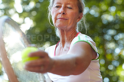 Buy stock photo Woman, tennis racket and ball closeup for serve sport for workout, game play or match. Mature, female person and exercise hand or bat on fitness court for retirement cardio or hobby, fun in summer