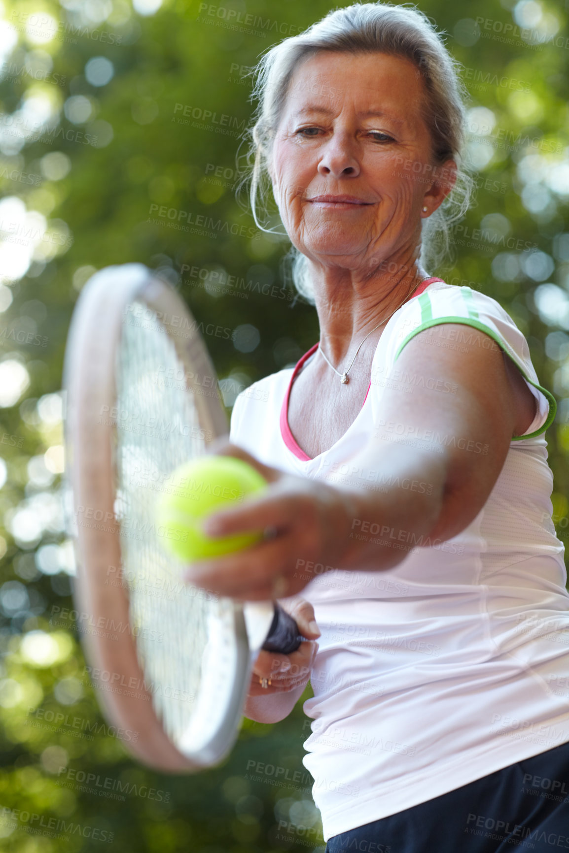 Buy stock photo Senior woman getting ready to serve - Tennis