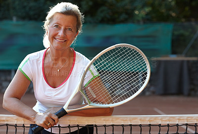 Buy stock photo Portrait, woman and racket in tennis court for sports training, workout and game or competition, exercise and fitness. Happy face of mature person or professional athlete by net for outdoor practice