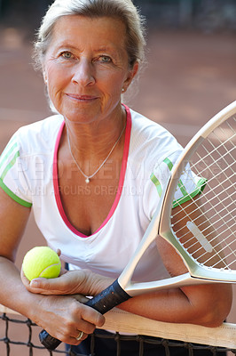 Buy stock photo Portrait, mature woman and ball in tennis court for sports training, workout and game or competition, exercise and fitness. Face of person or happy athlete with racket and net for outdoor cardio