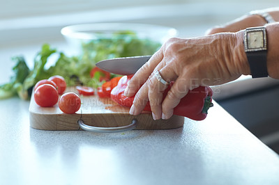 Buy stock photo Hands on chopping board, vegetables and knife on counter in kitchen cooking food. Closeup of cutting plants on table, preparation and tomato, pepper and nutrition for healthy lettuce salad in home