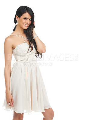Buy stock photo Studio shot of an attractive young woman in a cocktail dress posing against a white background