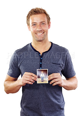 Buy stock photo Holding photograph, happy and portrait of man with picture as child for memory, nostalgia and past. Smile, white background and person with photo to remember childhood, youth and young self in studio