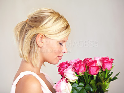 Buy stock photo Smelling, side profile and woman with flowers as a gift isolated on a white studio background. Aroma scent, romantic and girl with a bouquet of roses for valentines day or anniversary on a backdrop