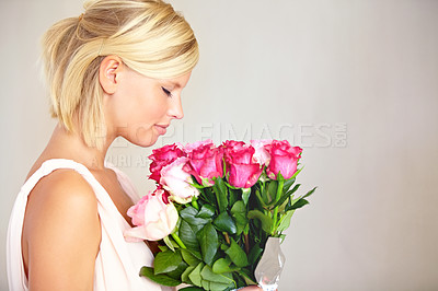 Buy stock photo Bouquet, woman and roses in studio for valentines day, gift or thank you gesture on grey background. Fresh, rose and girl with flowers, happy and relax with floral arrangement  and copy space