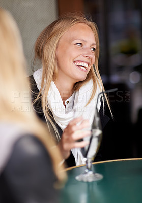 Buy stock photo Friends, woman and drink in a cafe, relax and happiness with conversation, weekend break and laughing. People, girl and restaurant with a glass, speaking and funny with humor, talking and discussion