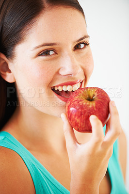 Buy stock photo Health, diet and portrait of woman with apple eating for nutrition, wellness and snack in studio. Food, happy and face of person with fruit for vitamins, detox and lose weight on white background