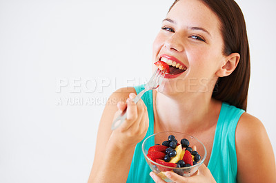 Buy stock photo Fruit salad, happy and portrait of woman in studio eating for nutrition, wellness and snack. Food, balance diet and face of person with berries for vitamins, detox and lose weight on white background