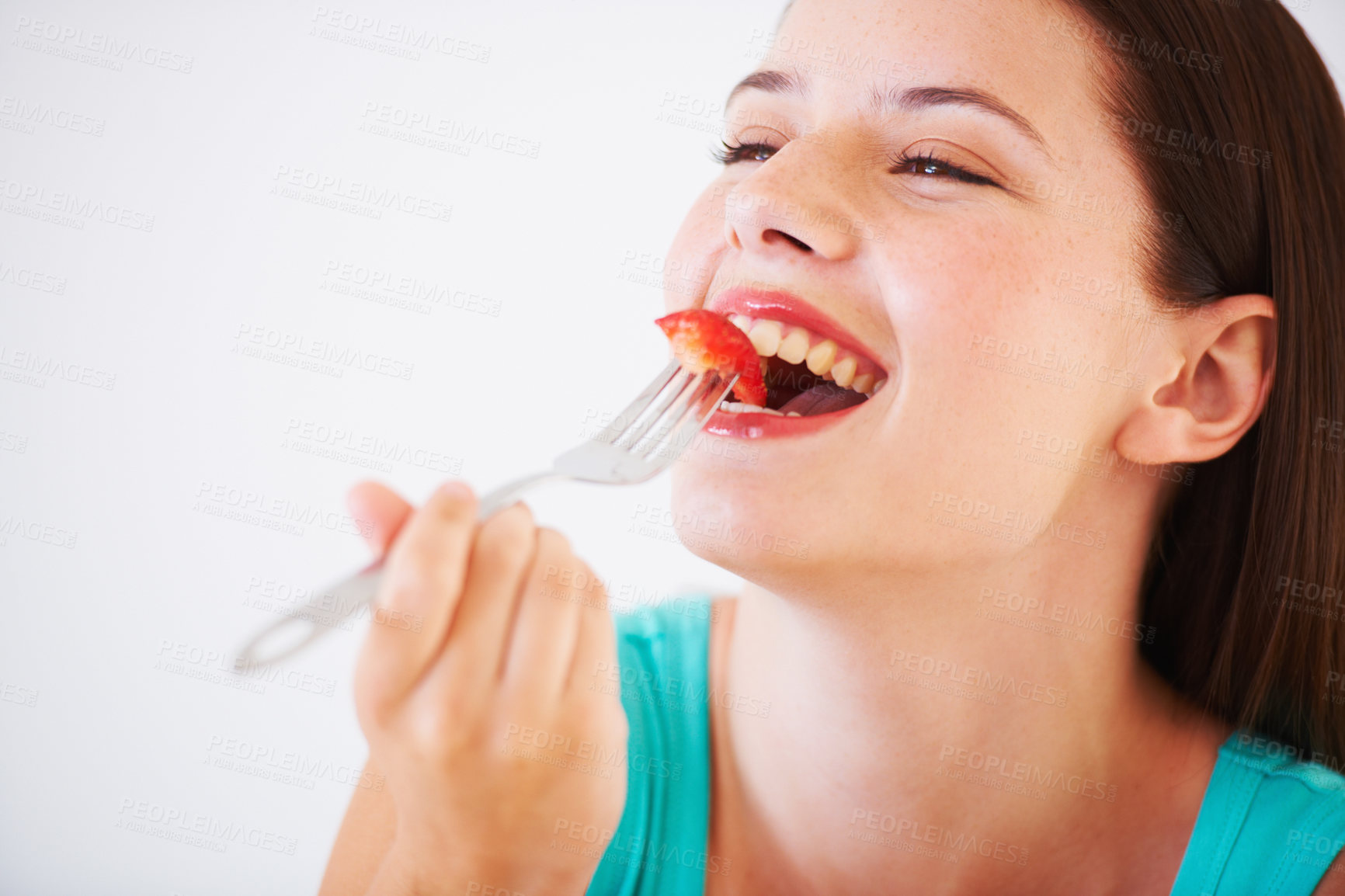 Buy stock photo Health, strawberry and woman with fruit in studio eating for nutrition, wellness and snack. Food, happy and face of person with berries for balance diet, detox and lose weight on white background