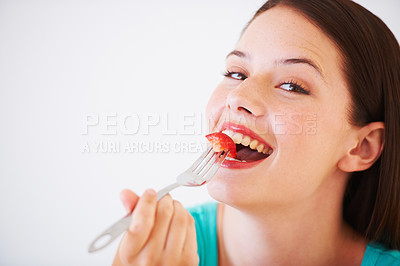 Buy stock photo Health, happy and portrait of woman with strawberry eating for nutrition, wellness and snack in studio. Food, balance diet and face of person for vitamins, detox and lose weight on white background