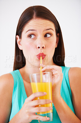 Buy stock photo Funny, drink and face of woman with juice for nutrition, wellness and hydration in studio. Beverage, smoothie and thirsty person with fruit blend for vitamins, detox and diet on white background