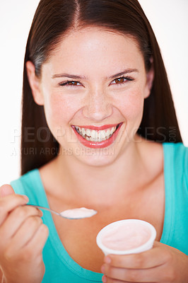 Buy stock photo Woman, eating and portrait with yogurt or healthy food, diet or nutrition in studio with happiness. Happy, face and girl with spoon, yoghurt and strawberry flavor of dairy, product or snack for lunch