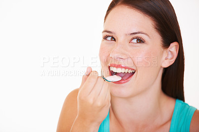 Buy stock photo Eating, yogurt and portrait of woman with healthy food, diet or nutrition in studio with happiness. Happy, face and girl with spoon, yoghurt and strawberry flavor of dairy, product or snack for lunch