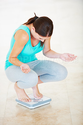 Buy stock photo Unhappy, woman and check weight with scale in bathroom with confused, disbelief or surprise. Diet, fail or frustrated person reading numbers on weighing device with horror, shock and disappointment