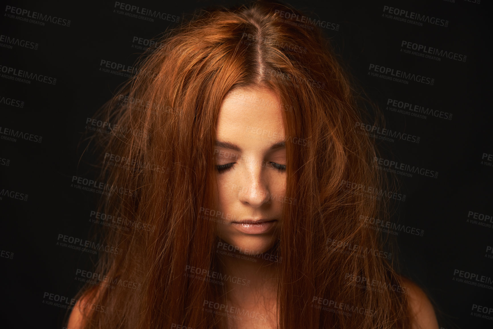 Buy stock photo A pretty redhead with messy hair
