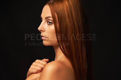 Buy stock photo Hair care, ginger or woman thinking of beauty, skincare or results for glow, shine or collagen in studio. Black background, growth or serious model with cosmetics for healthy texture or textures