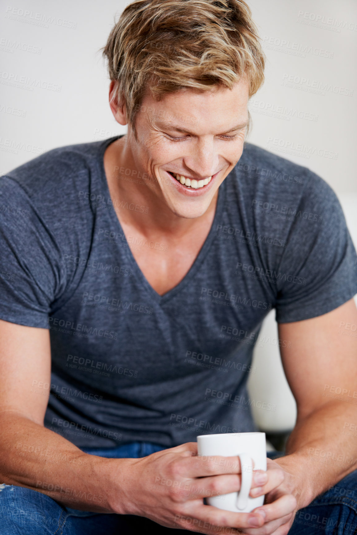 Buy stock photo Smile, coffee to relax and a man in studio isolated on a gray background with caffeine in a mug or cup. Tea, happy and a satisfied young model drinking a fresh warm beverage alone in the morning