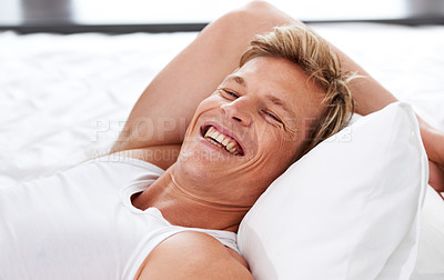 Buy stock photo Man, smile and relax in bed for confidence or casual wellness, summer break or happy. Male person, laugh and rest for weekend or vacation chill for morning zen or holiday nap, stress free in home