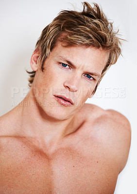 Buy stock photo Portrait of a muscular young man posing in studio