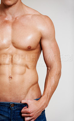 Buy stock photo Man, fitness and muscle with abs, sexy and shirtless for chest, strong and model in studio background. Alone, hot and jeans for six pack, topless and bodybuilder for health, exercise and pose