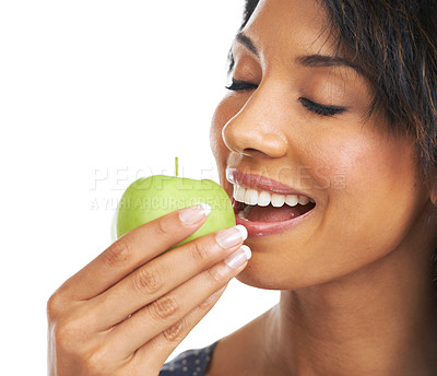 Buy stock photo Woman, studio and apple with smile, nutrition and hungry for healthy, organic snack and eating by white background. Black woman, happy and natural green fruit for diet, energy or wellness by backdrop