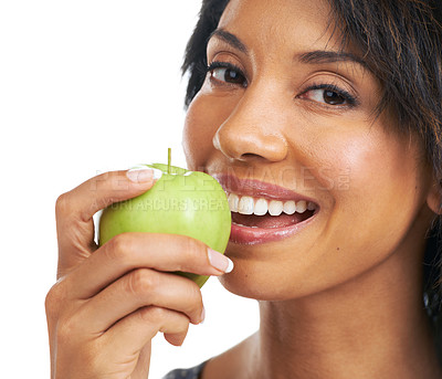 Buy stock photo Apple, teeth and woman eating in studio for health, wellness and vegan diet with food or fruits promotion. Healthcare, self care and black woman with fruit choice for nutrition in a portrait smile
